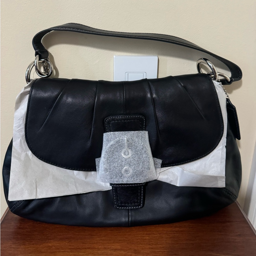NWT Coach Soho flap bag in black leather